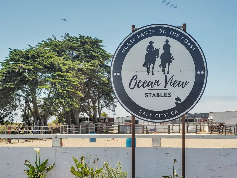 The Ocean View Stables sign in front of the arena in Daly City
